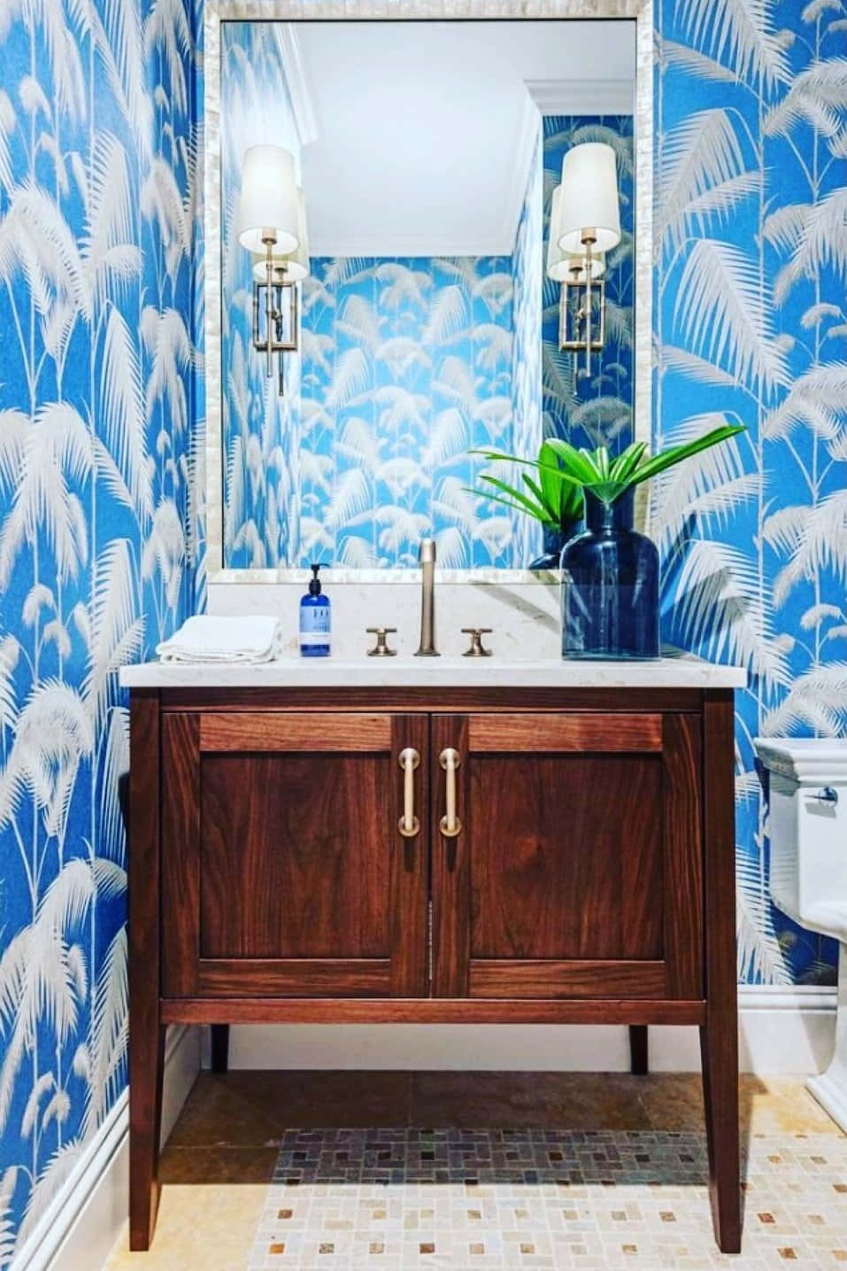 A Sumptuous Blue And White Bathroom With Feather Patterned Wall Background