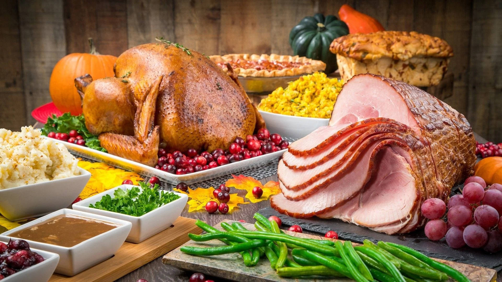 A Sumptuous Feast Of Ham And Roasted Turkey For Dinner Background