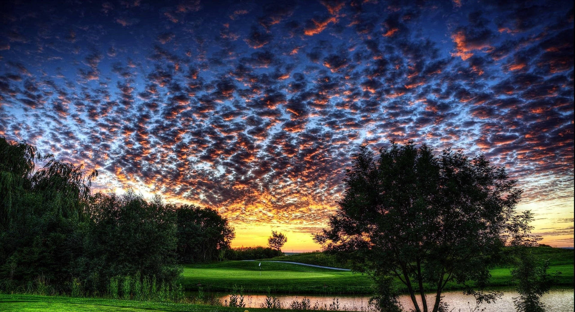 A Sunset Over A Golf Course Background