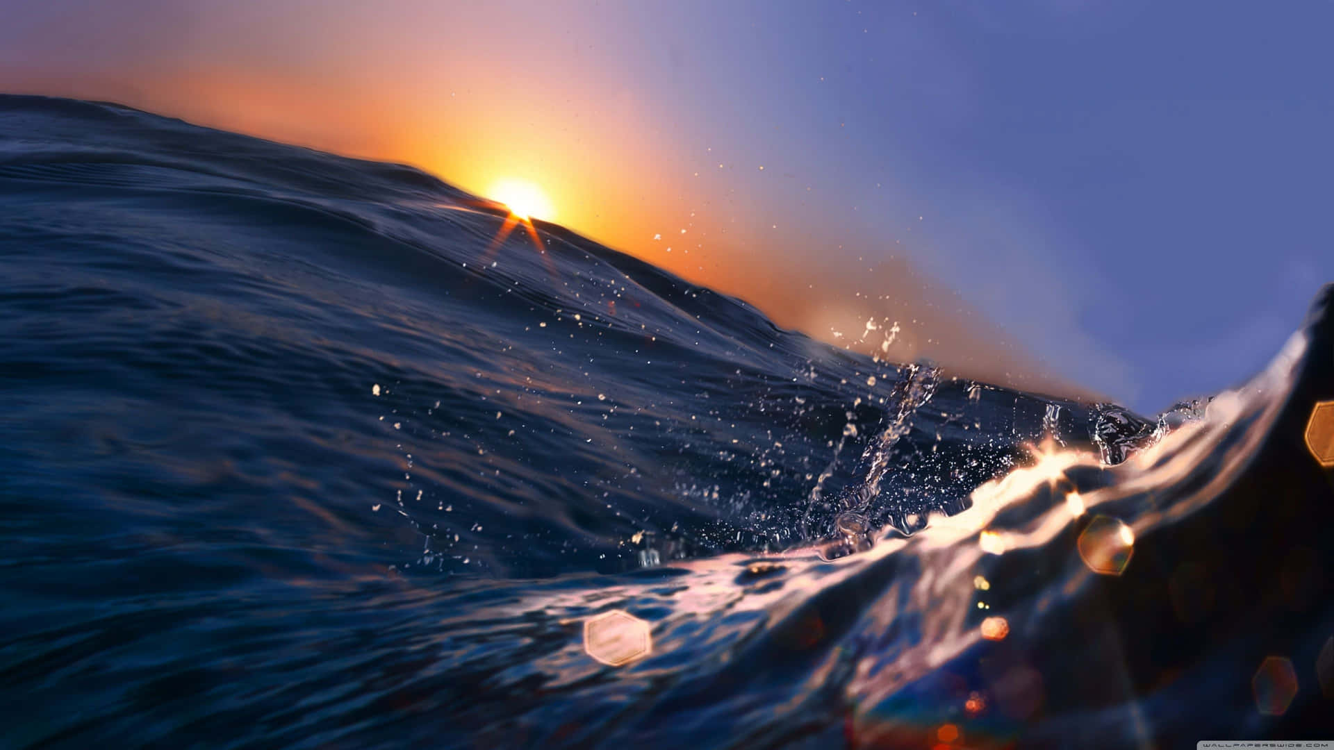 A Sunset Over The Ocean With Waves Background