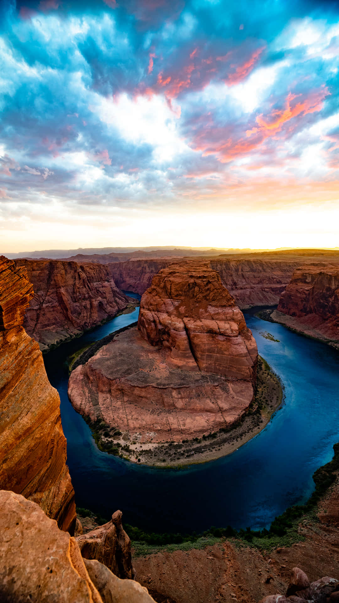 A Sunset Over The River In Horseshoe Canyon Background