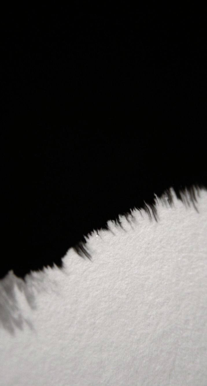 A Surface Split By Black Smudges