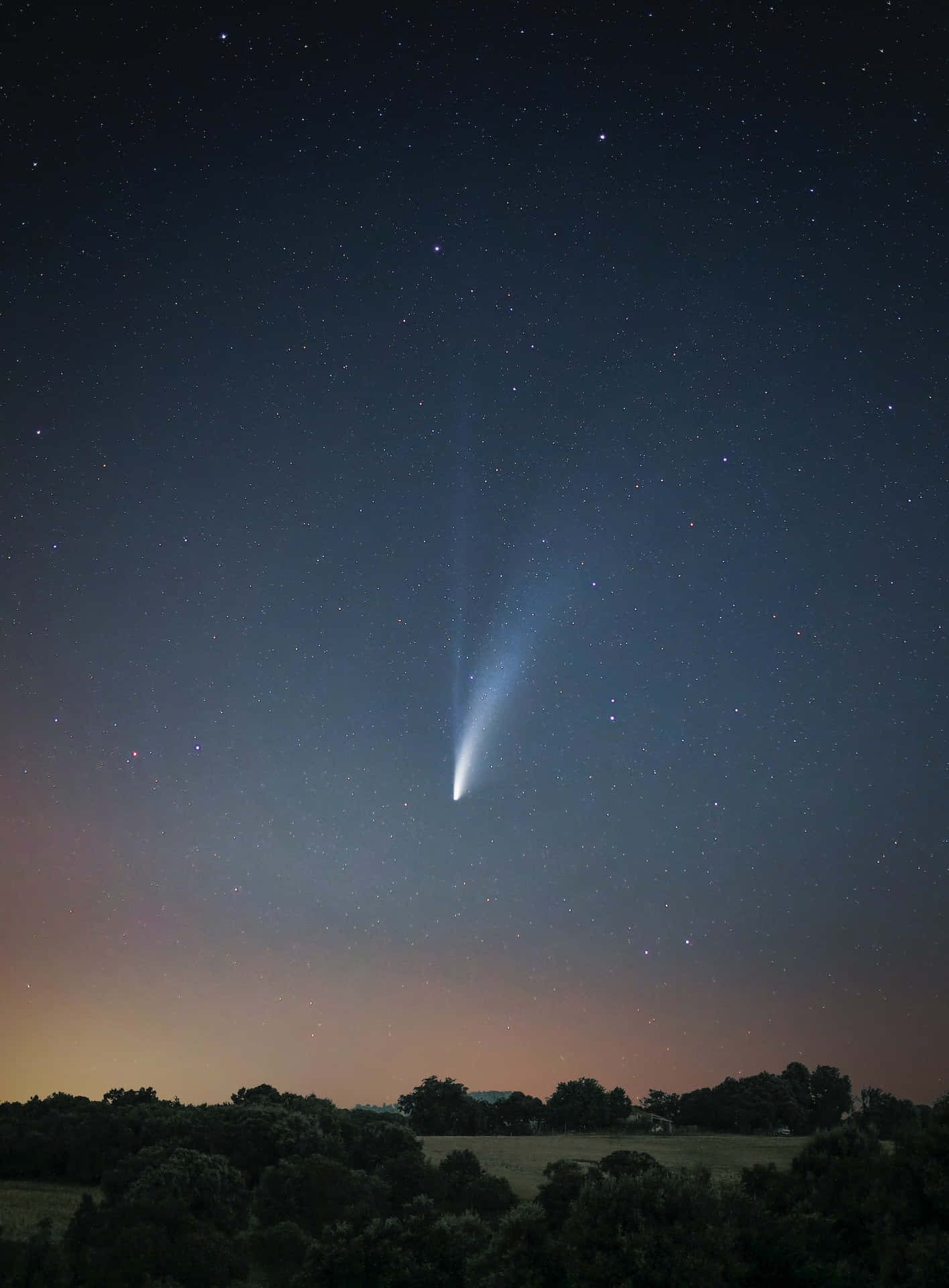 A Sweeping Comet Across The Night Sky Background