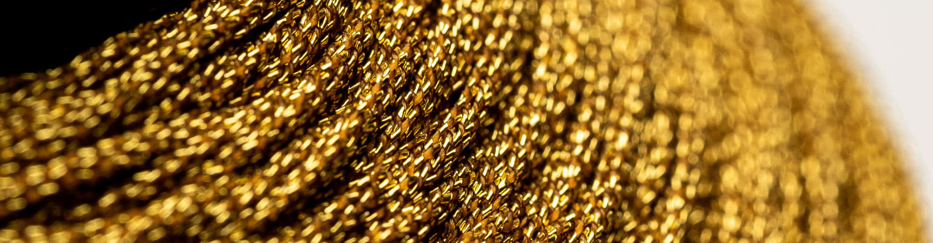 A Swirling Pattern Of Pure Metallic Gold Background