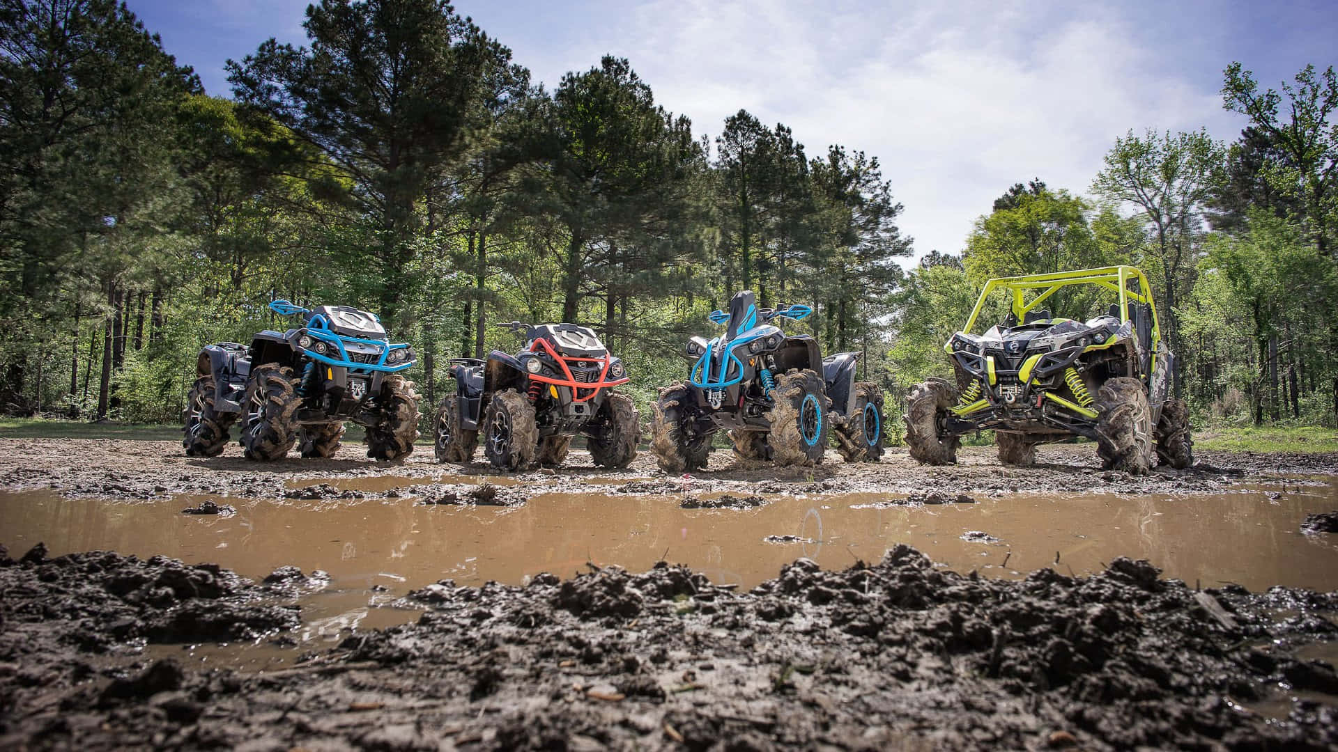 A T Vs_ Lined_ Up_ In_ Muddy_ Terrain Background