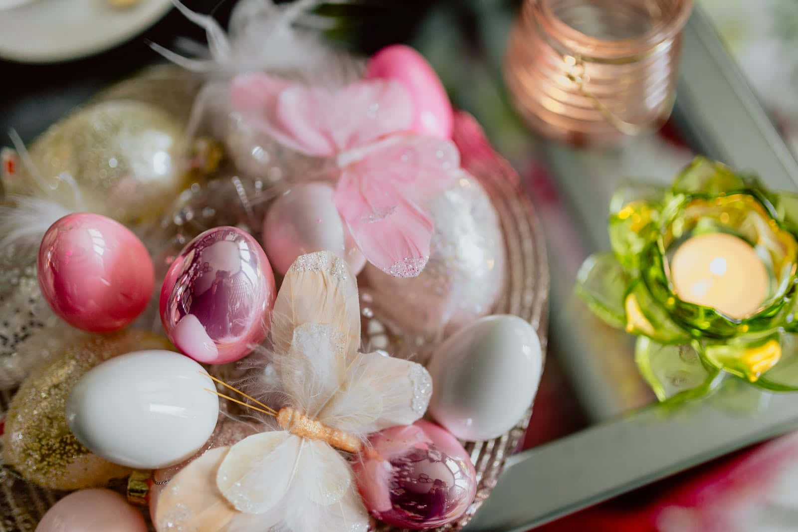 A Table With Easter Eggs And Flowers On It