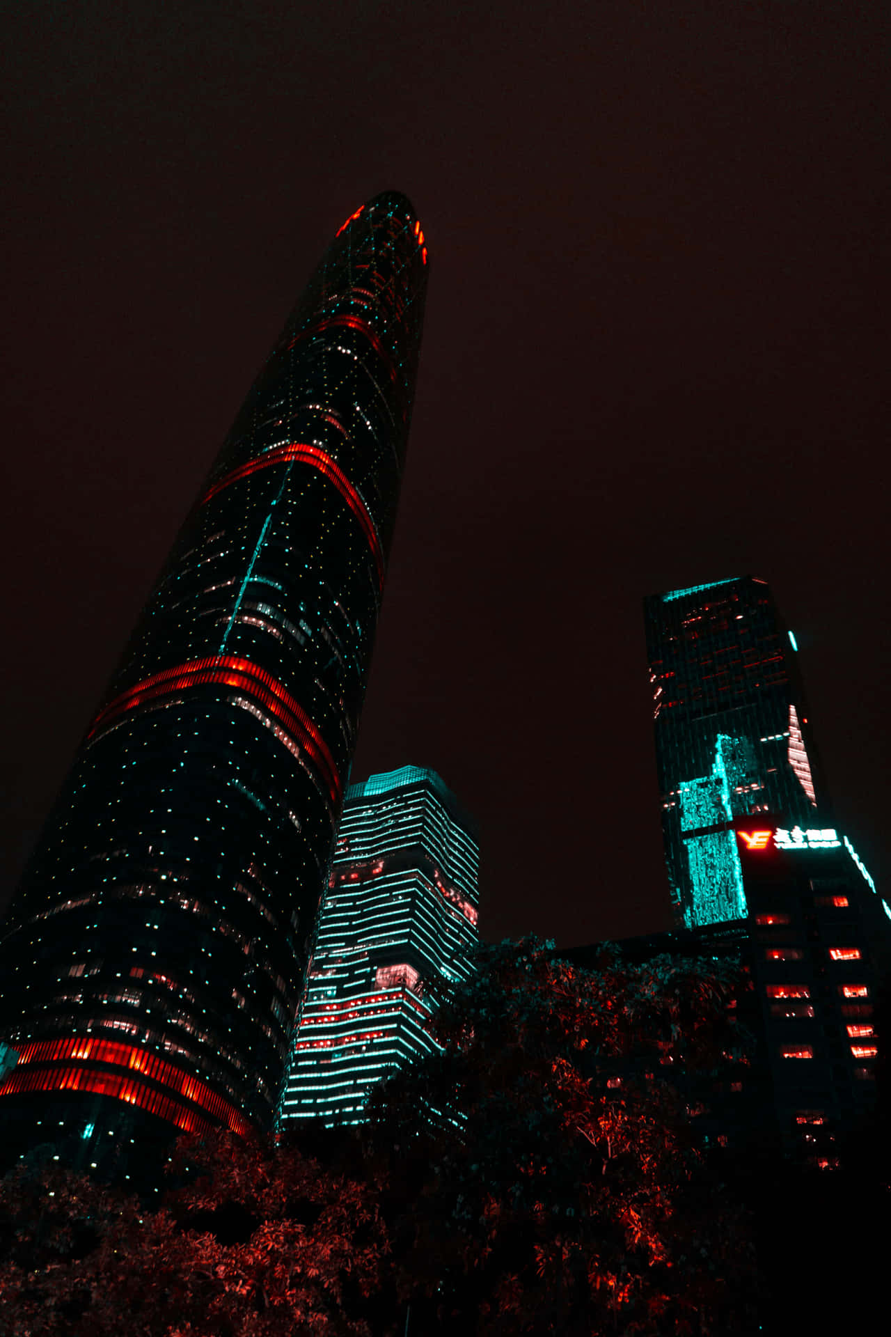 A Tall Building With Red Lights Background