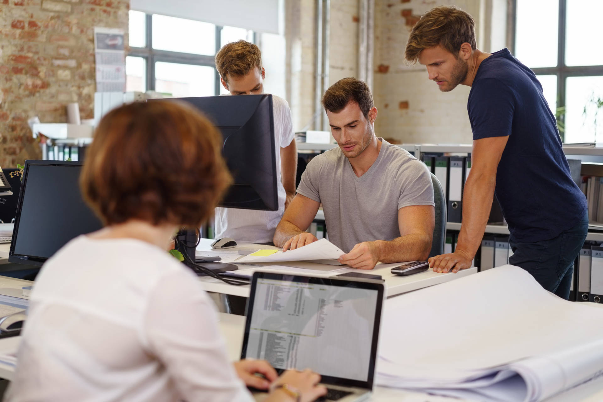 A Team Of Enterprise Employees Engaged In A Project Task