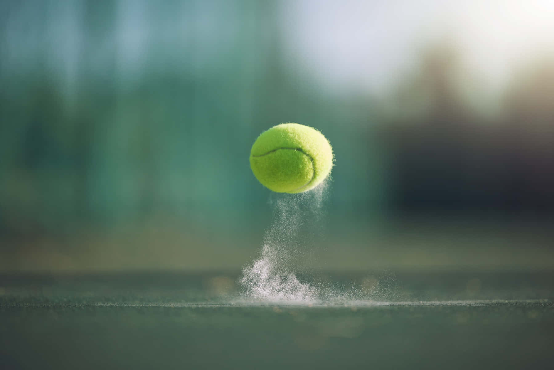 A Tennis Ball Is Flying In The Air Background