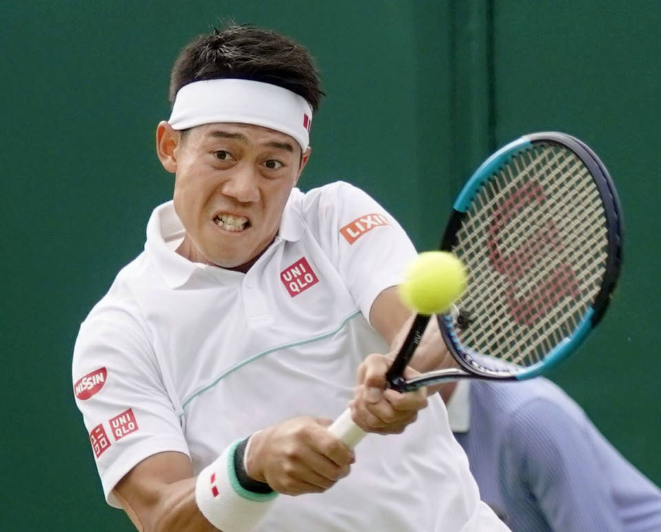 A Tennis Player Is Hitting A Ball With His Racket Background