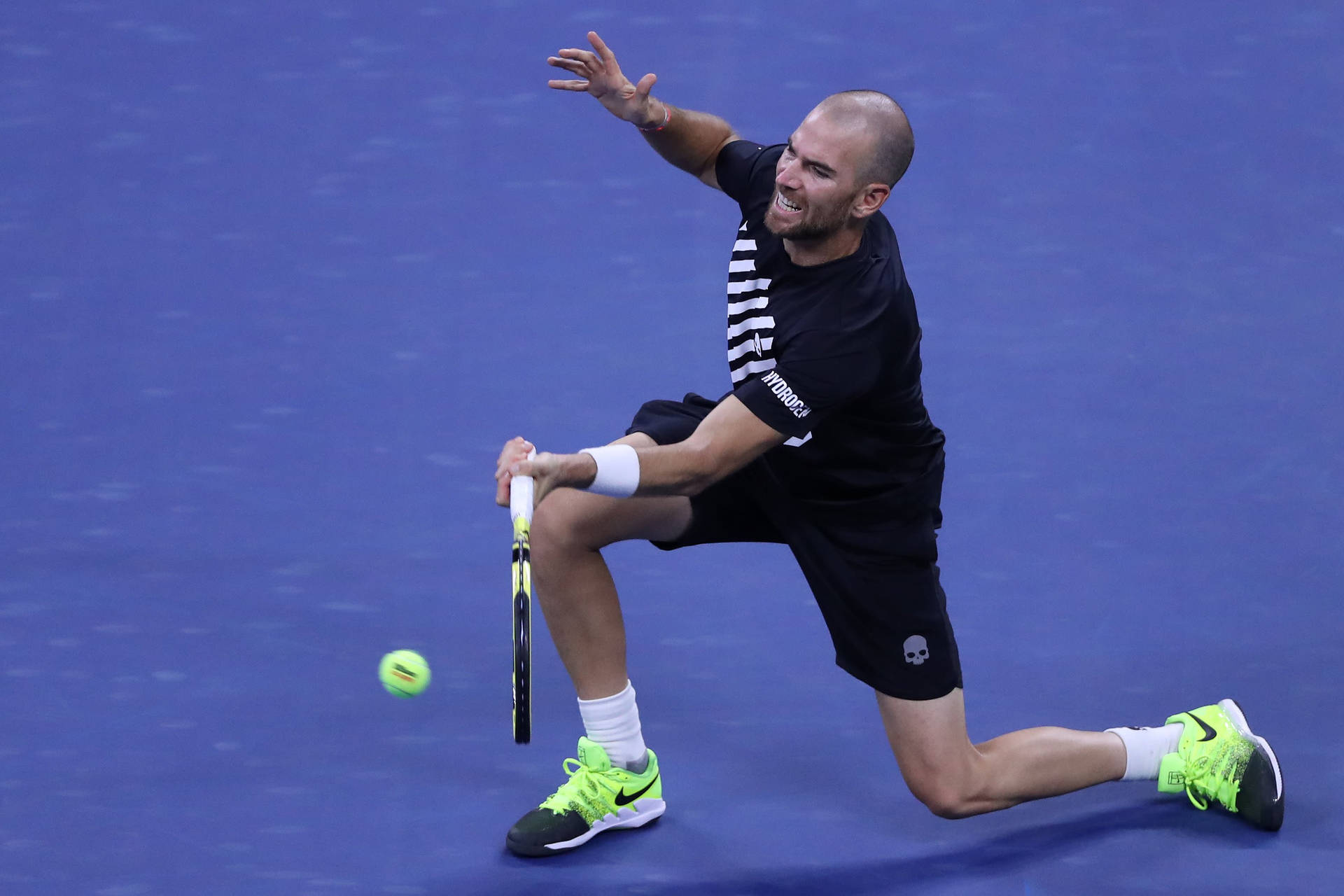 A Tennis Player Is Preparing To Hit A Ball