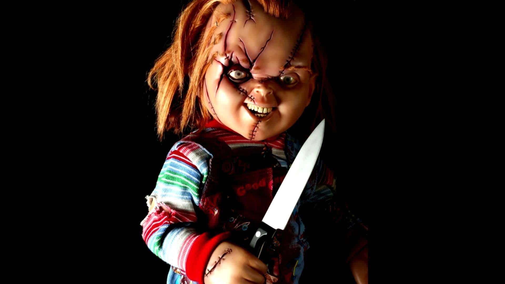 A Terrifying Scene With A Chucky Doll Looking Straight At The Camera. Background