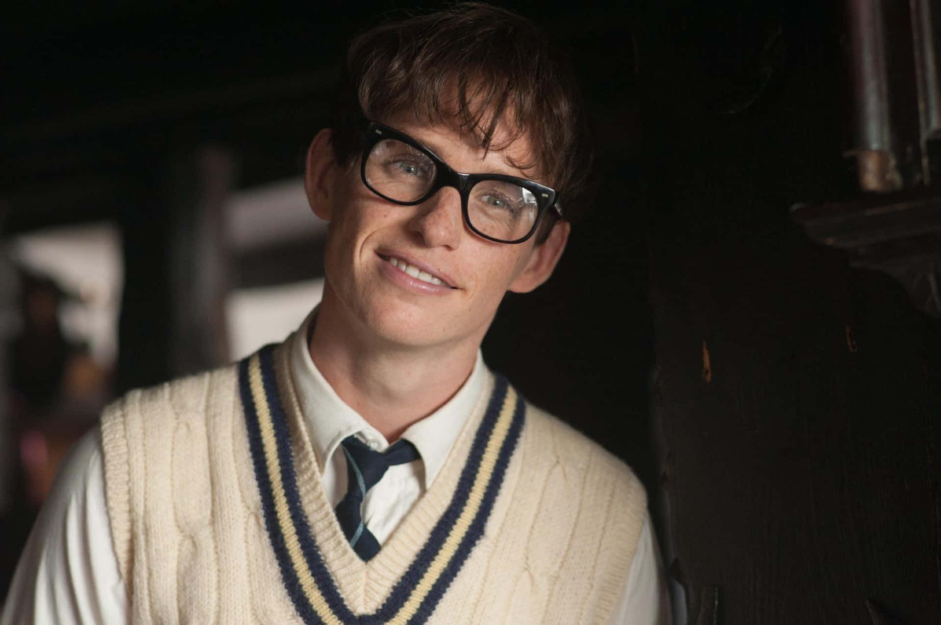 A Thoughtful Eddie Redmayne Looking At The Distance Background