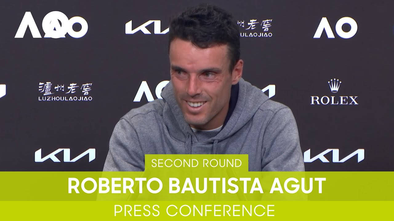 A Thoughtful Roberto Bautista Agut At A Press Conference Background