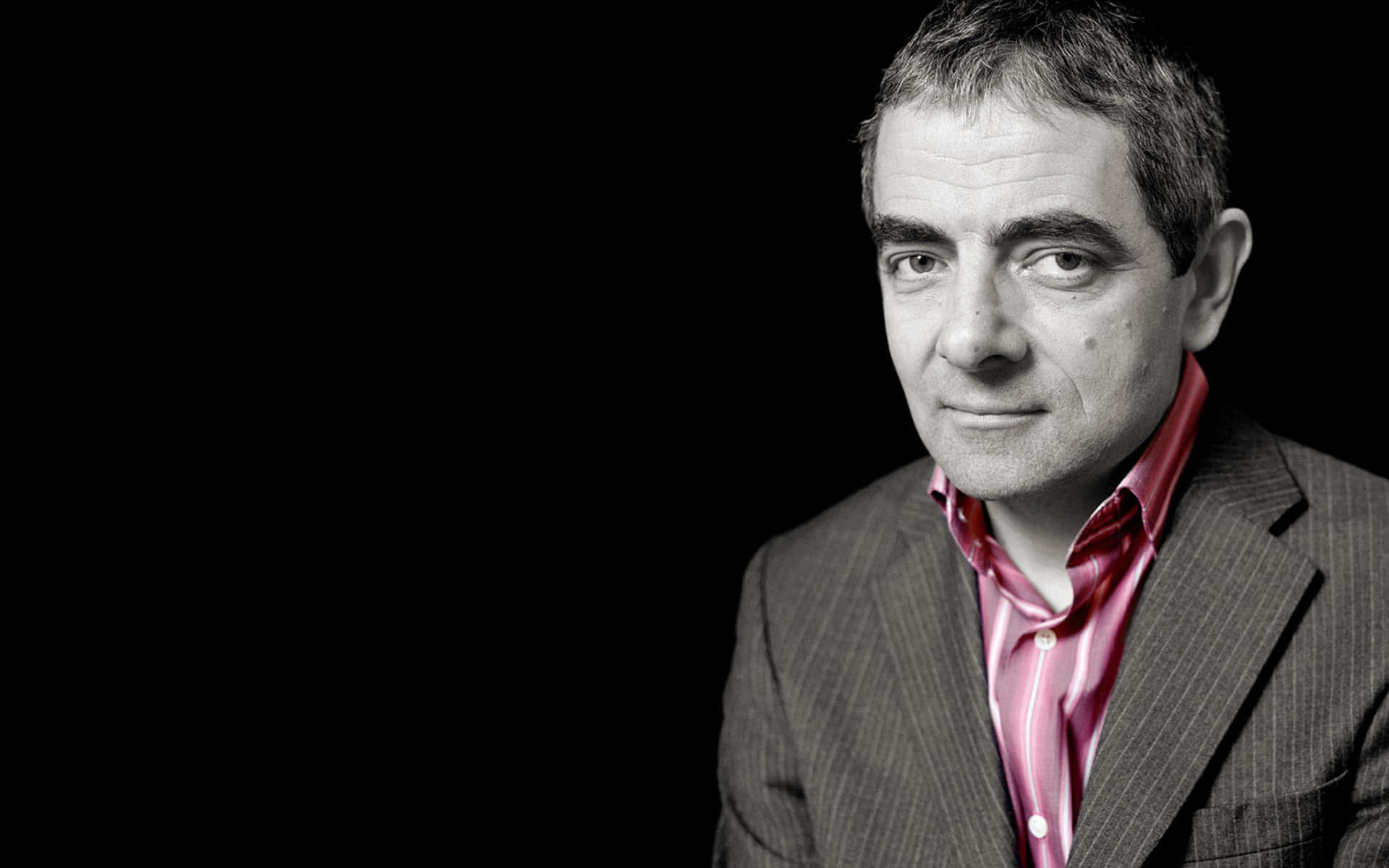 A Thoughtful Rowan Atkinson Background