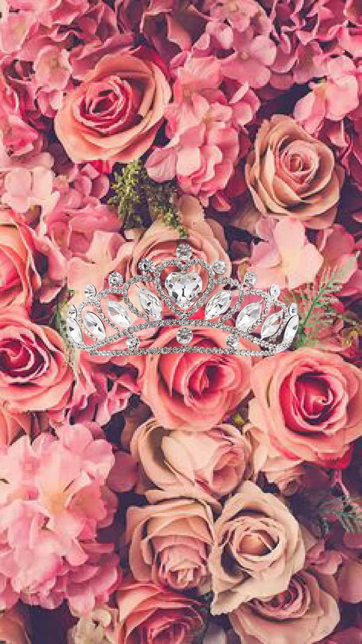 A Tiara With Pink Flowers On It Background