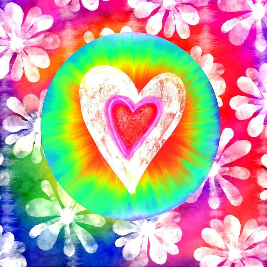 A Tie Dye Heart With Flowers On It Background