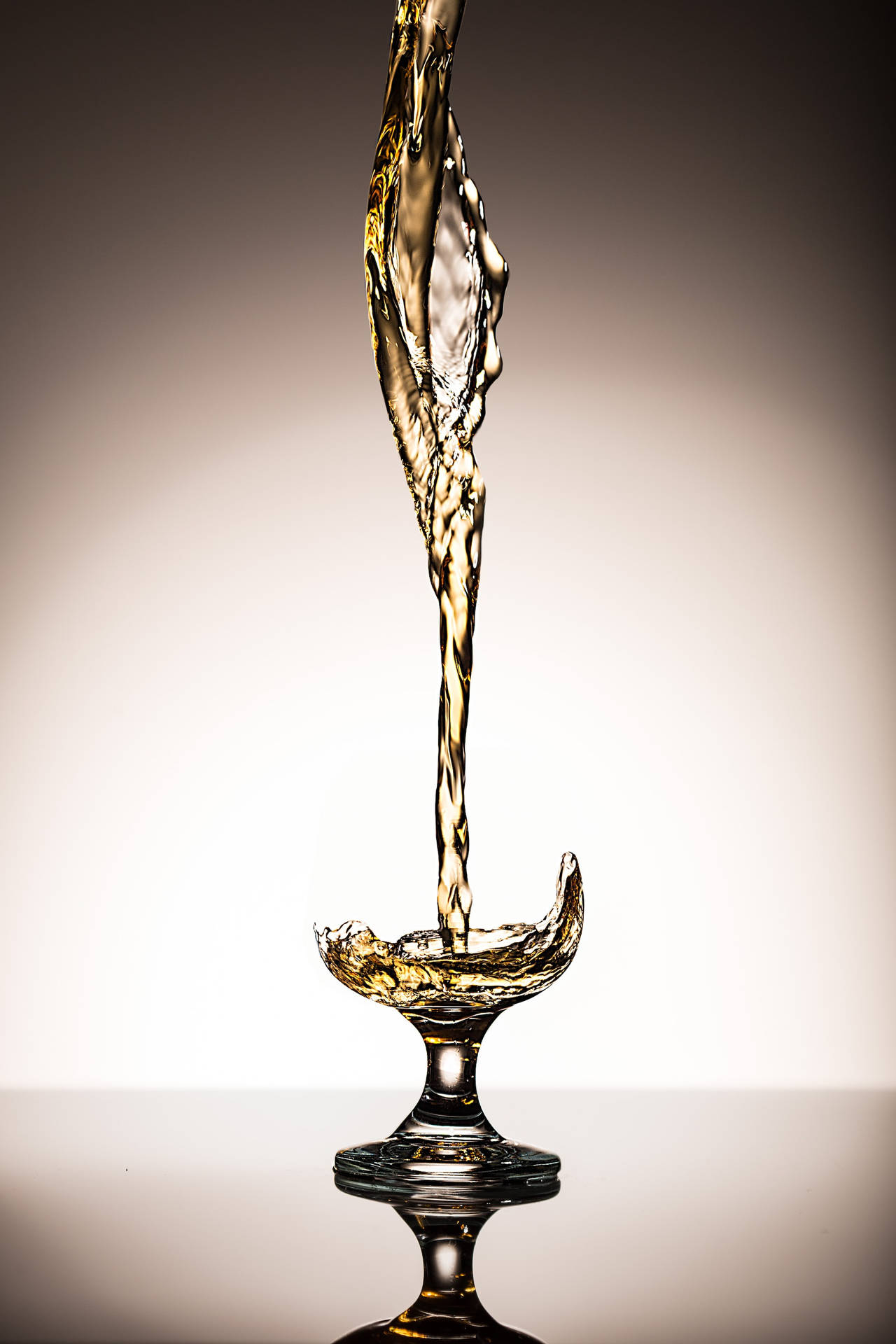 A Toast To Elegance - Flowing Whiskey In Drinking Glass Background