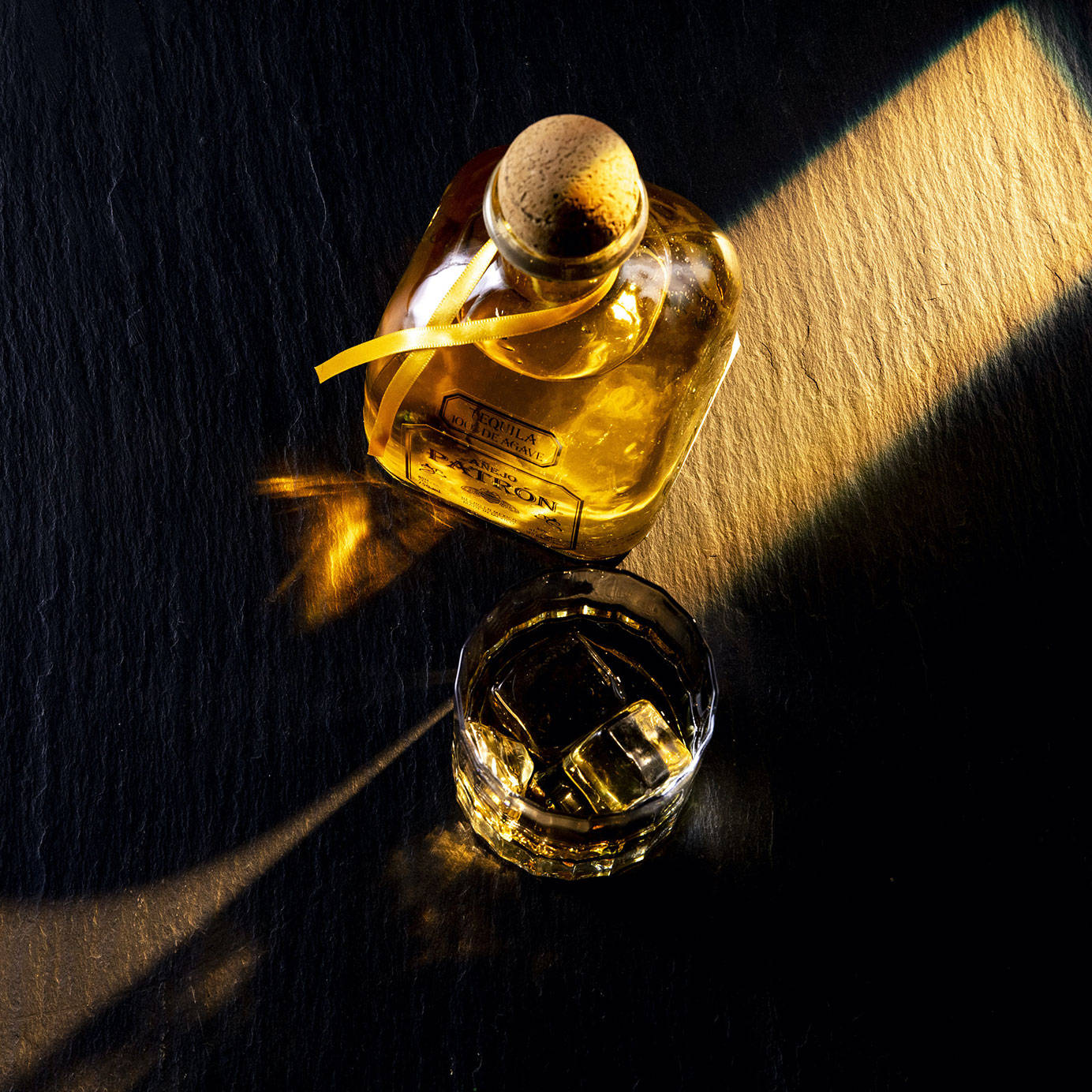 A Top-view Shot Of The Luxurious Deleon Tequila Bottle And Glass Background