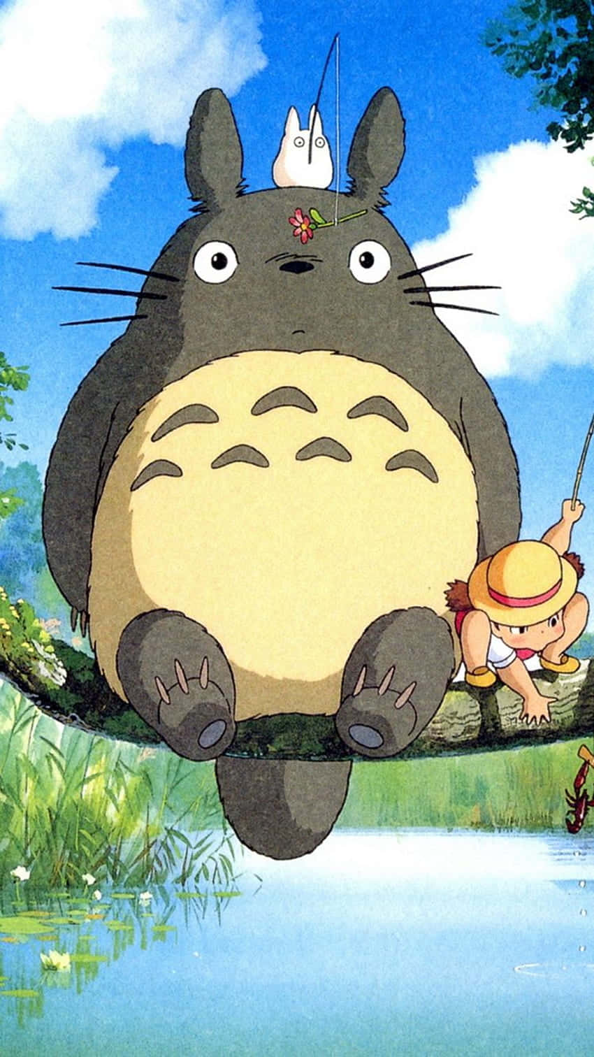 A Totoro And A Girl Sitting On A Branch