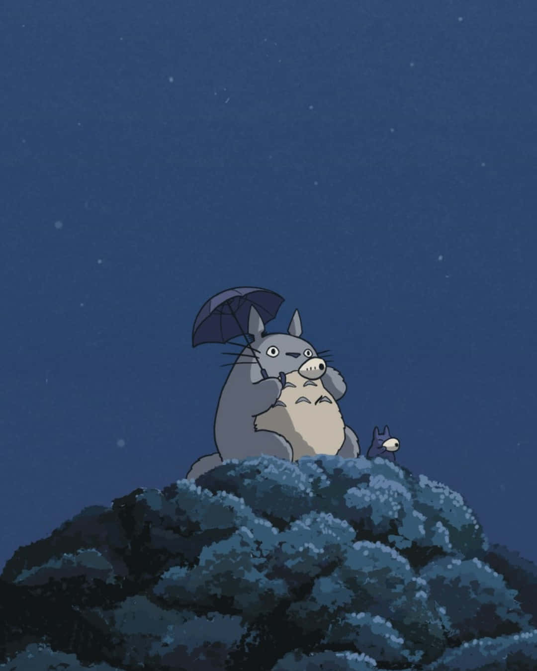 A Totoro Sitting On A Rock With An Umbrella