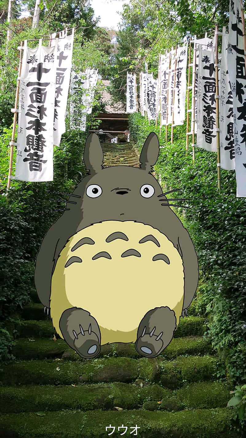 A Totoro Sitting On A Set Of Stairs