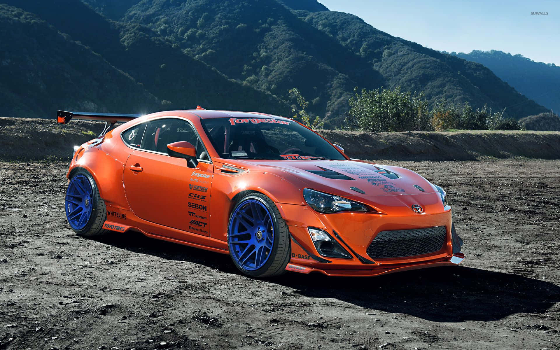 A Toyota 86 Parked On A Dirt Road Background