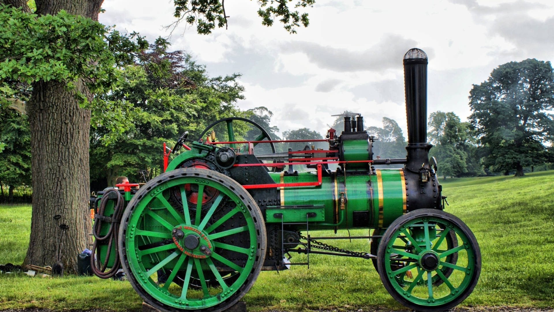 A Traditional Steam Tractor In Its Glory Background