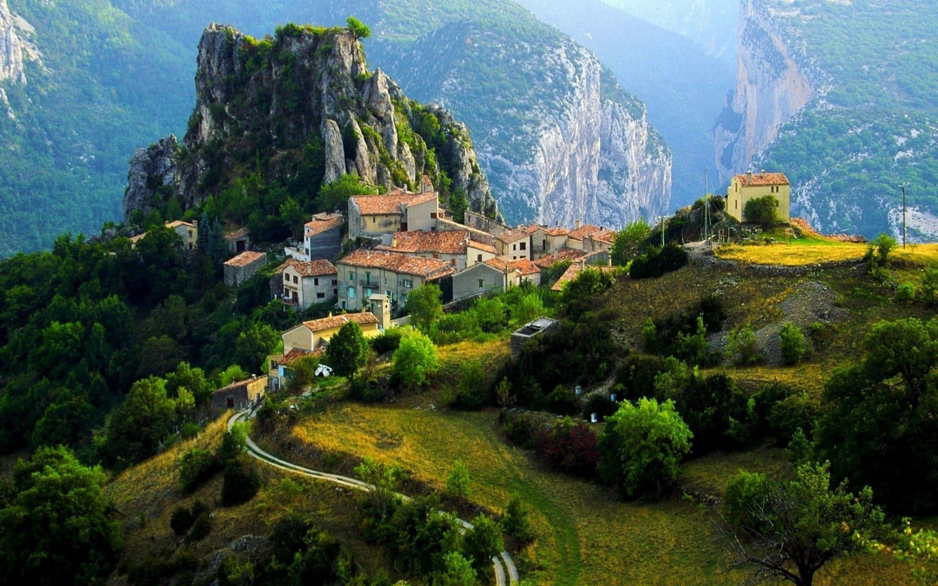 A Tranquil Scene Of A Rustic Mountain Village At Dusk Background