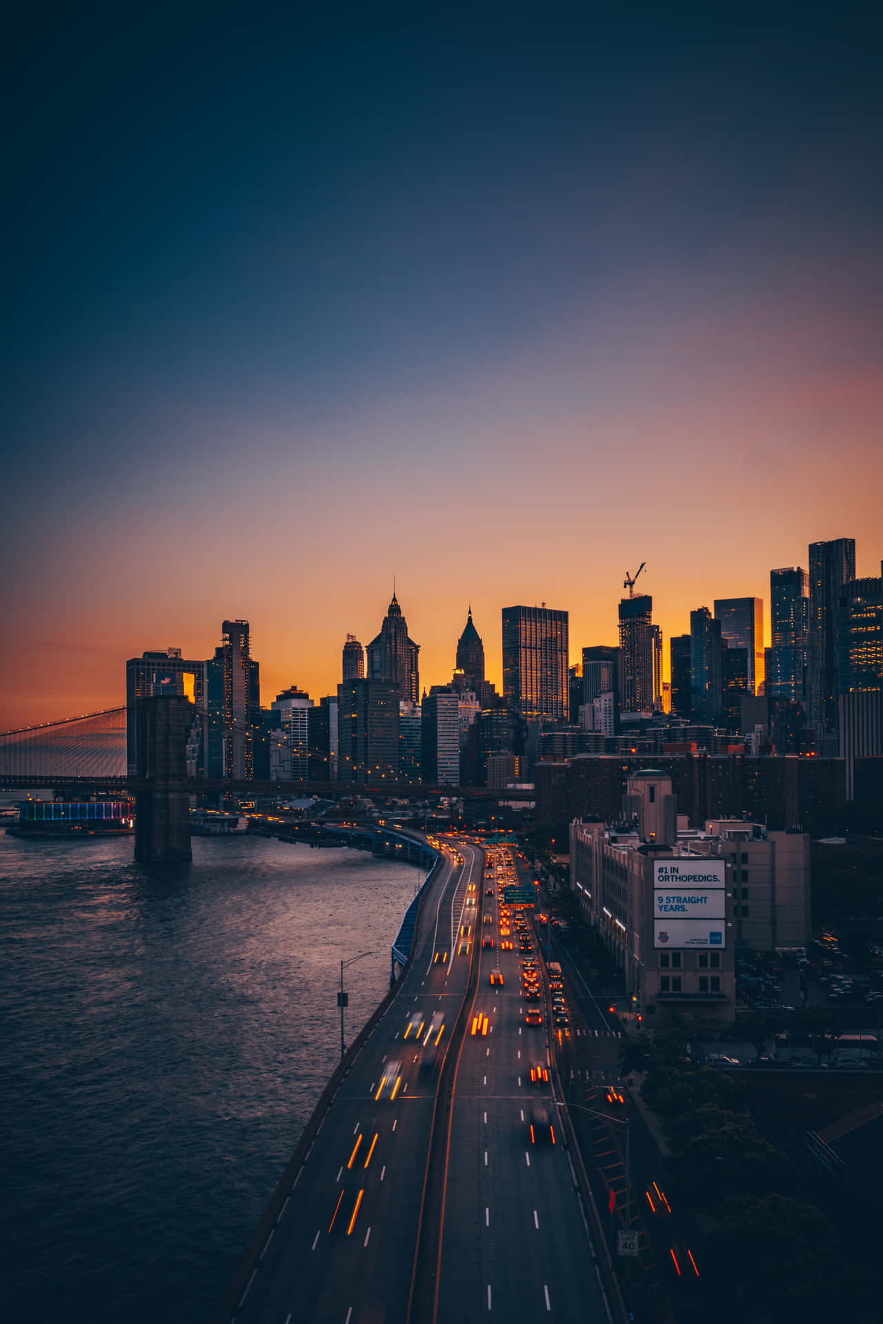 A Tranquil View Of The Skyline At Dusk Background