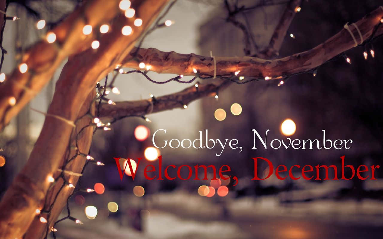 A Tree With Lights And The Words Goodbye November Welcome December Background