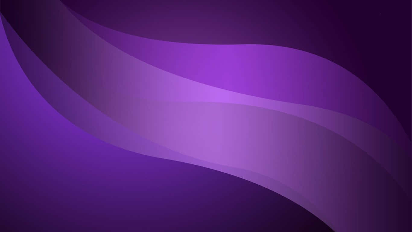 A Trendy Purple Laptop In Front Of Colorful Accessories Background