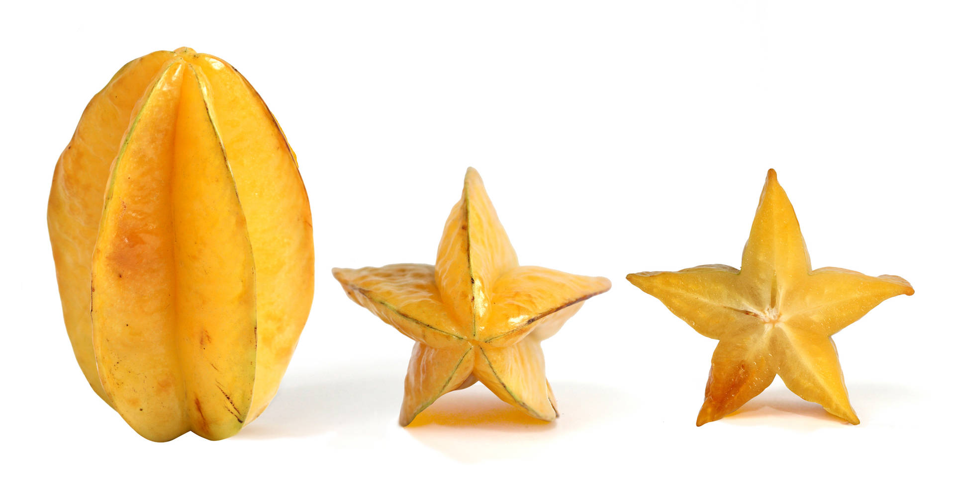 A Tropical Delight - Slices Of Vibrant Star Fruit Background