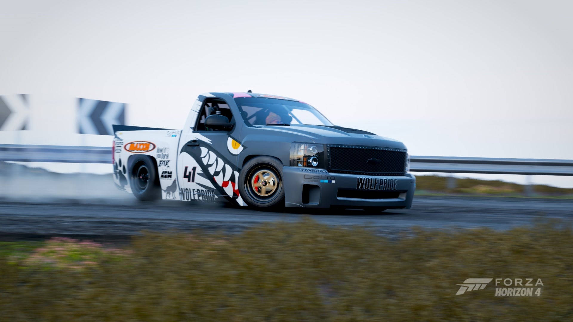 A Truck Driving Down A Track In A Racing Game