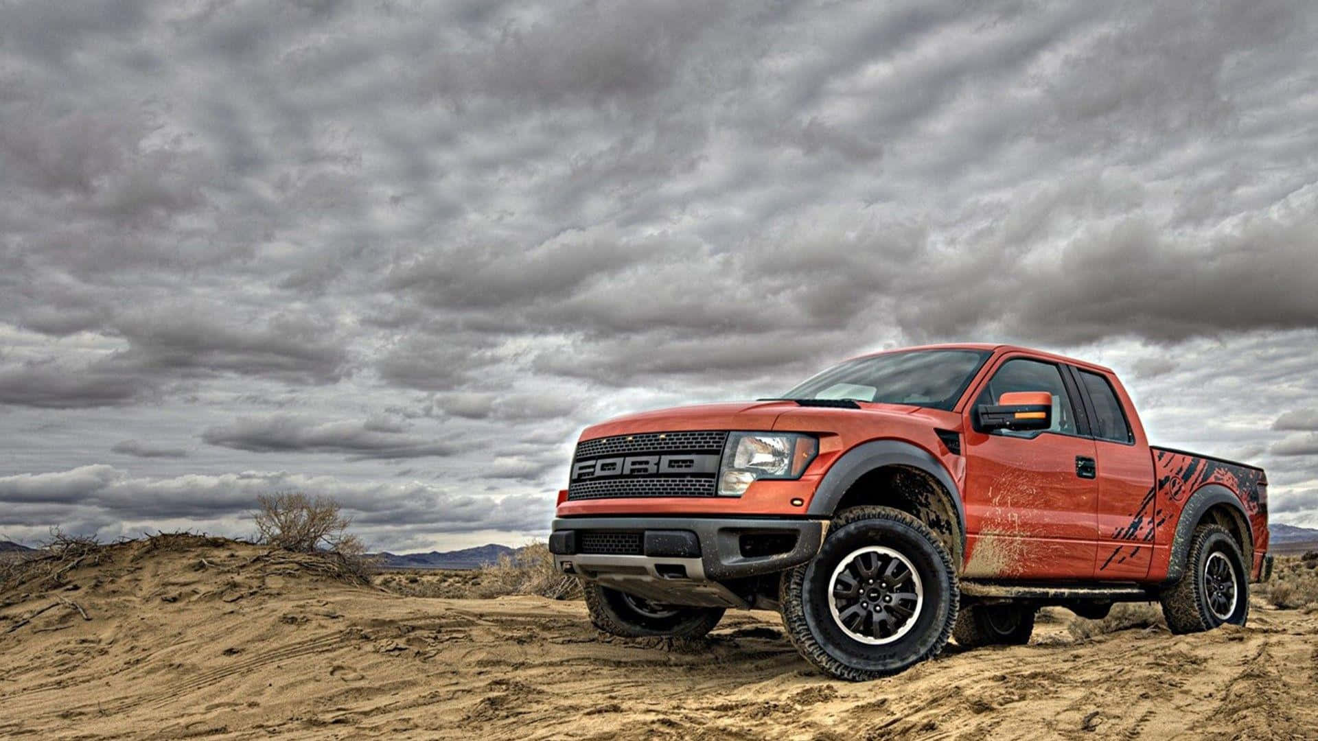 A Truck Is Driving On A Dirt Road