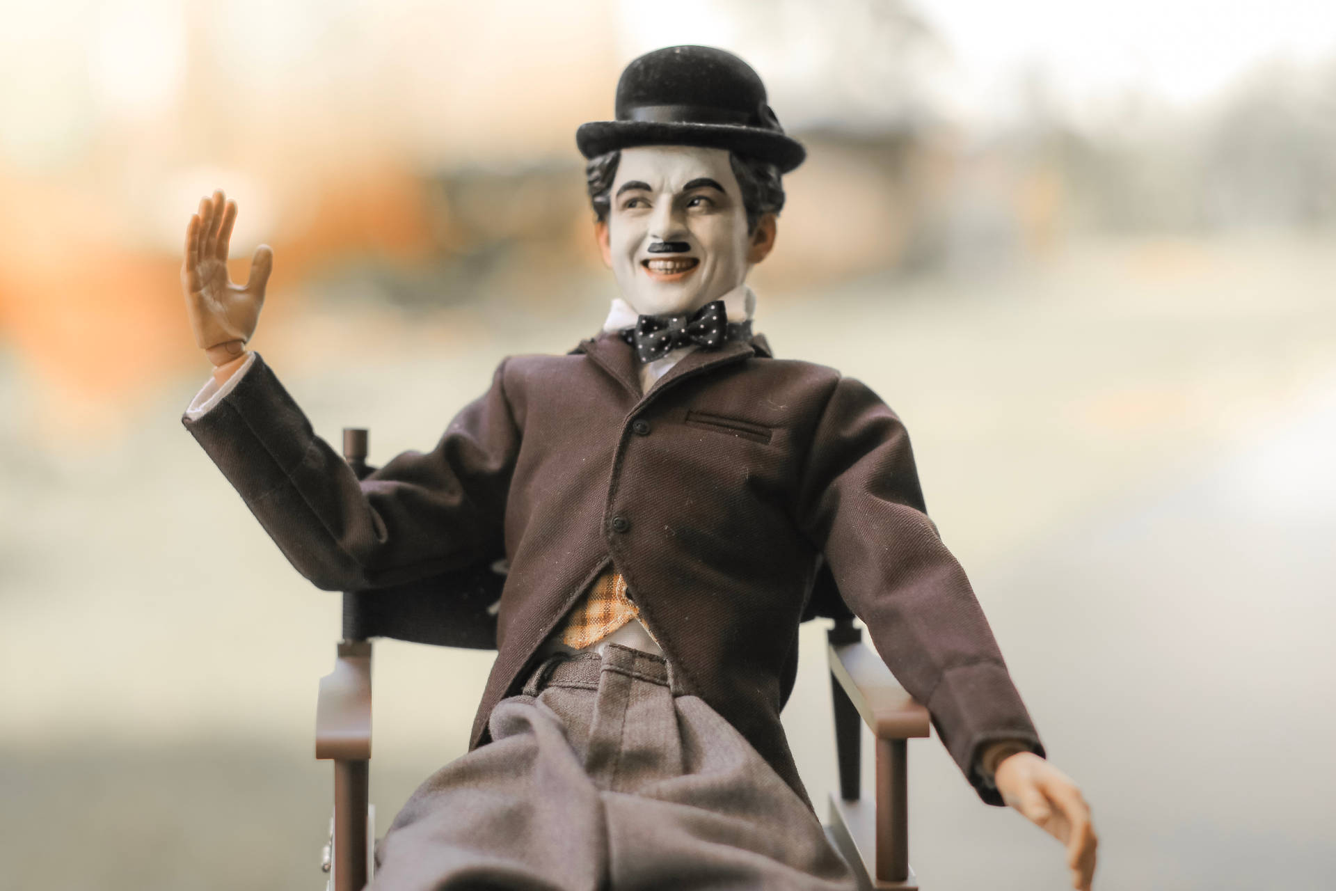 A Uniquely Colored Charlie Chaplin Figurine Background