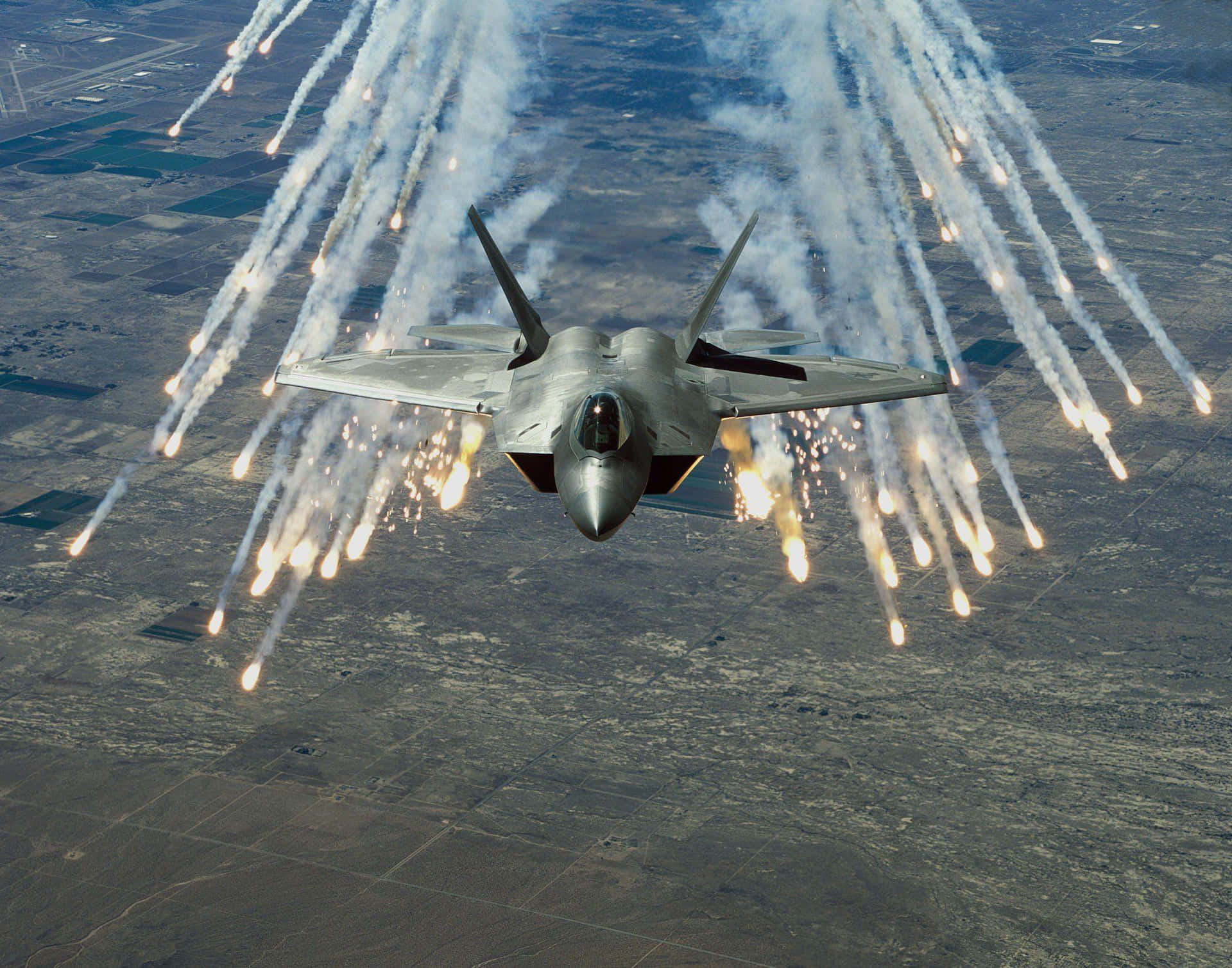 A Us Military Plane In Flight Background