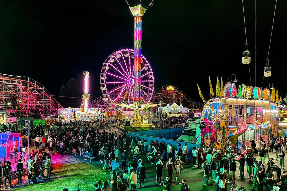 A Vibrant Bird’s Eye View Of A Bustling Fair Background