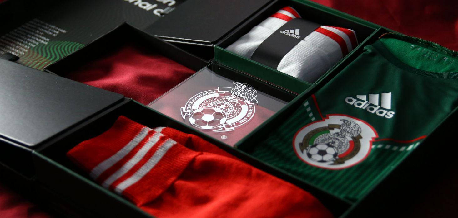 A Vibrant Display Of Mexican Pride: The Flag Of Mexico Imprinted On Sportswear. Background