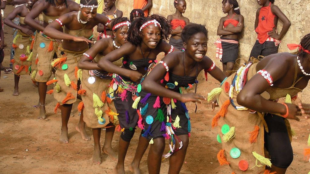 A Vibrant Display Of Traditional Dance In Guinea-bissau Background