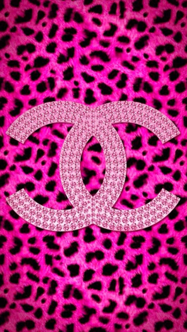 A Vibrant Pink Chanel Logo Background