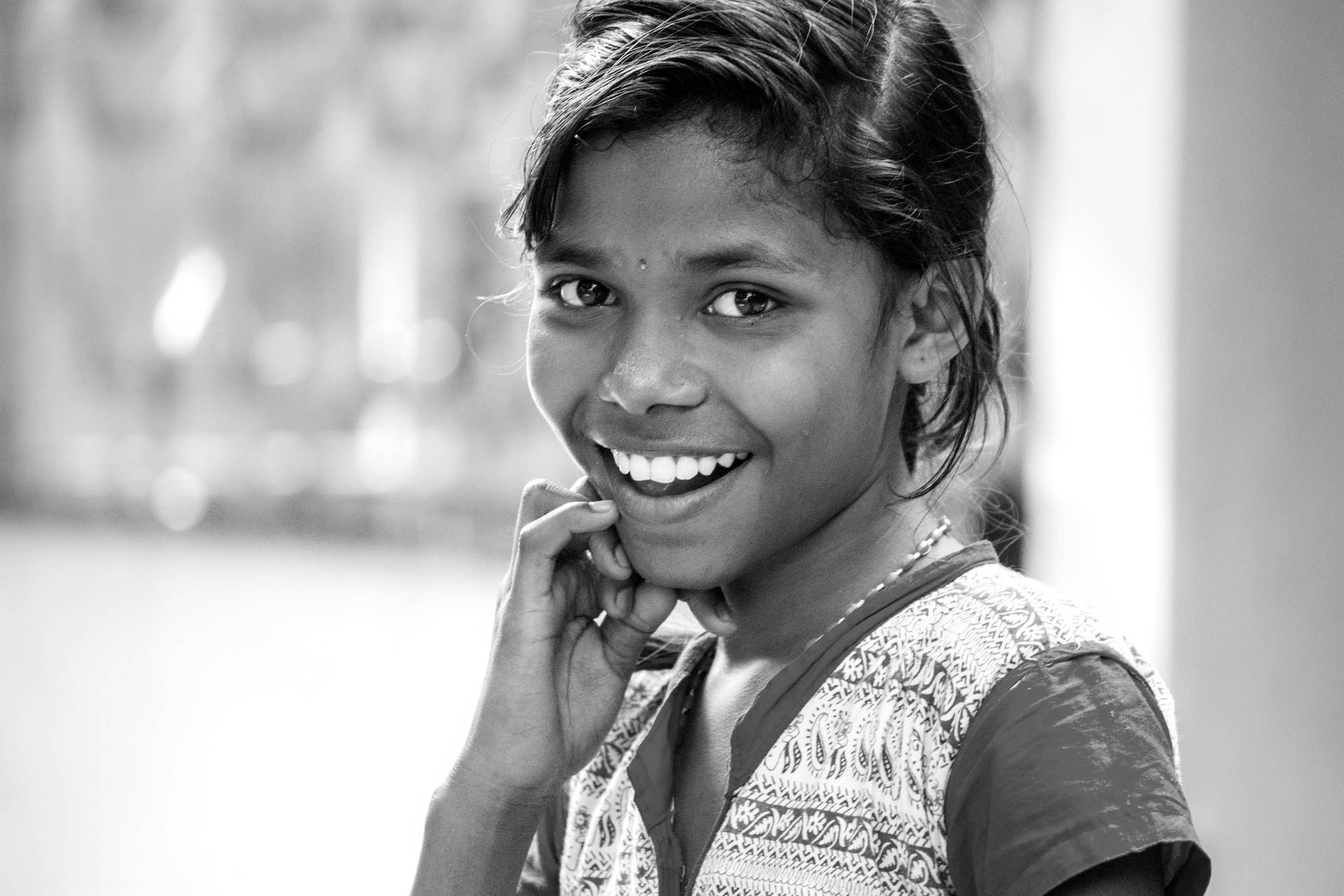 A Vibrant Portrait Of A Girl With A Captivating Smile Background