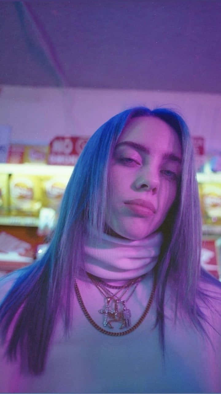 A Vibrant Portrait Of Singer-songwriter Billie Eilish In Purple Background