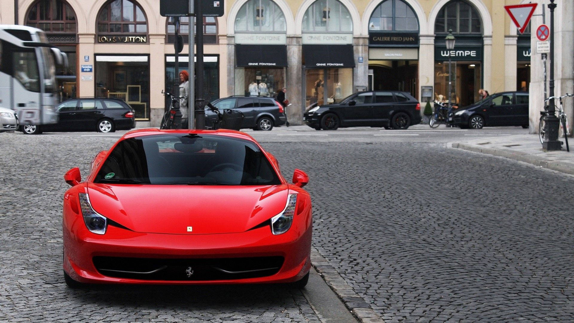 A Vibrant Red Ferrari F430 Caught In Motion Background