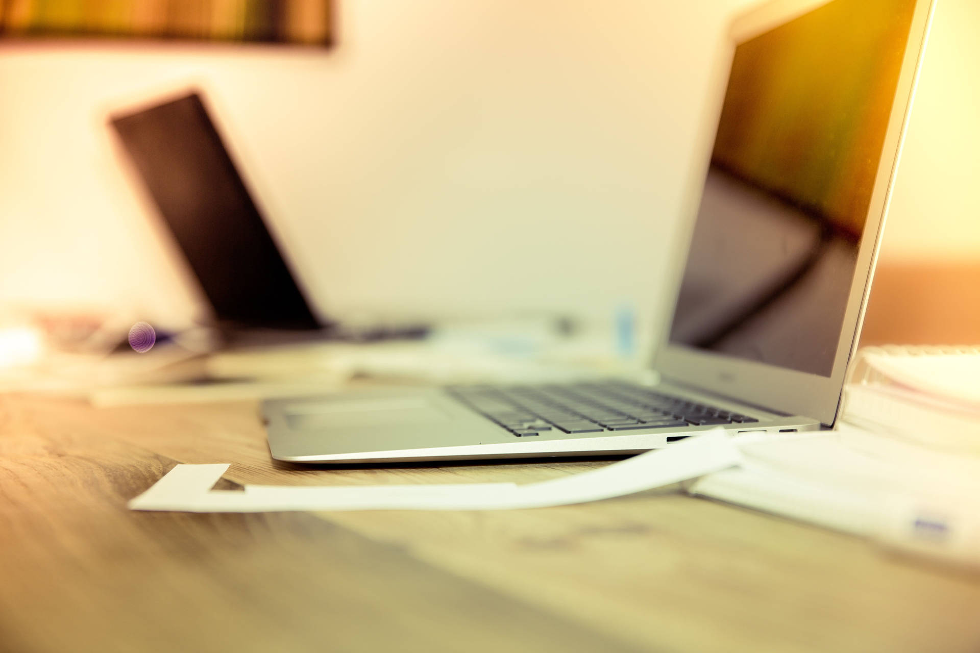 A Vibrant Workspace: Yellow Themed Office Desk Background