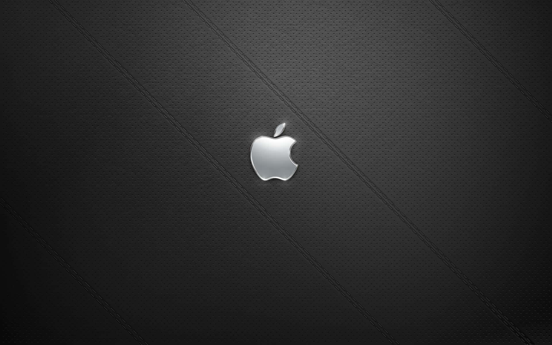 A View Of A Silver Apple Desktop Set Up With A Monitor And Keyboard Background
