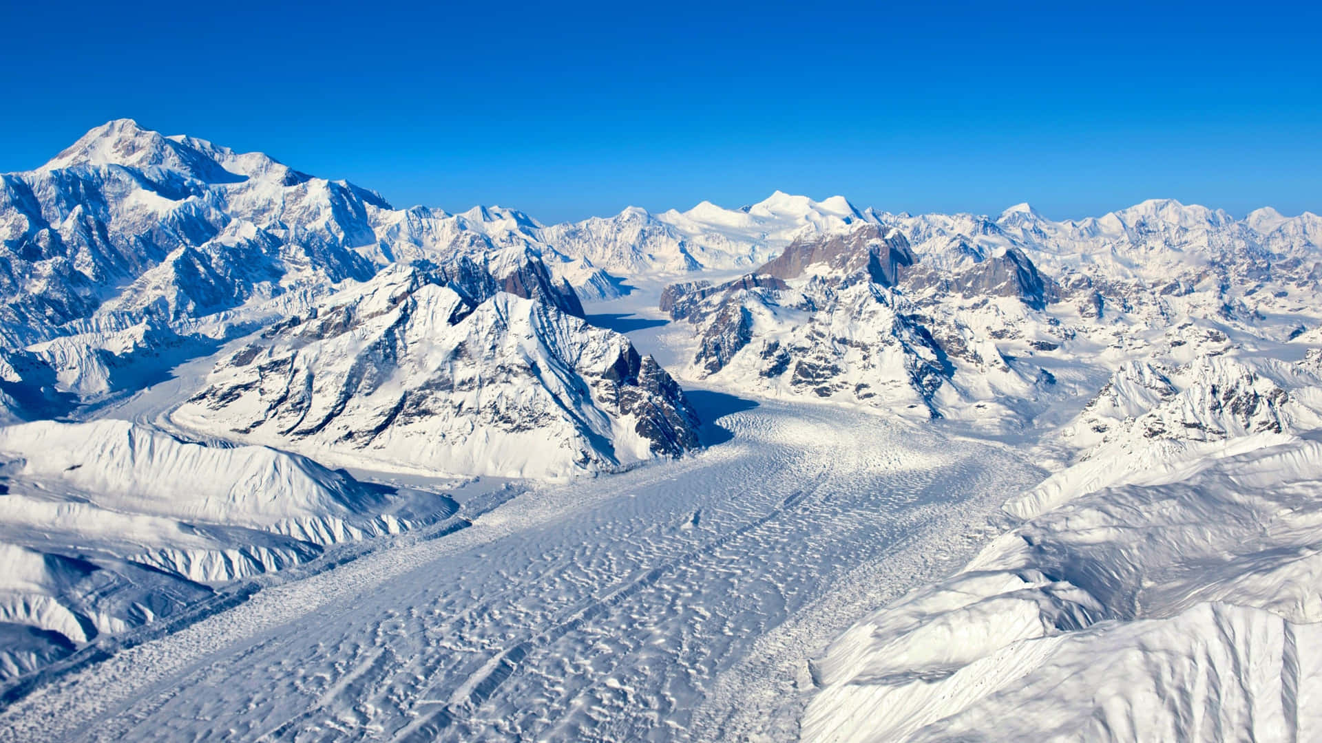 A View Of A Snow Covered Mountain Range Background