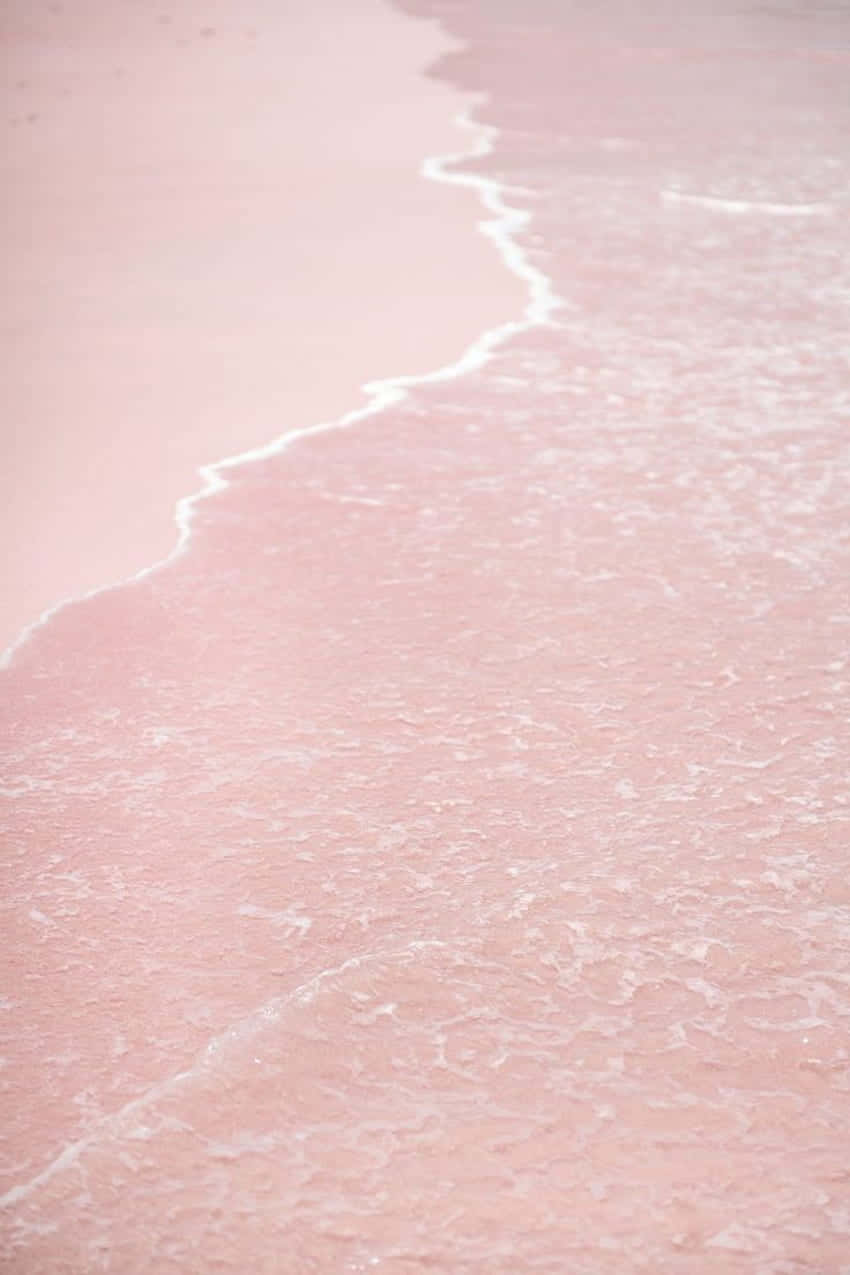 A View Of A Stunning Pink Sunset Beach.