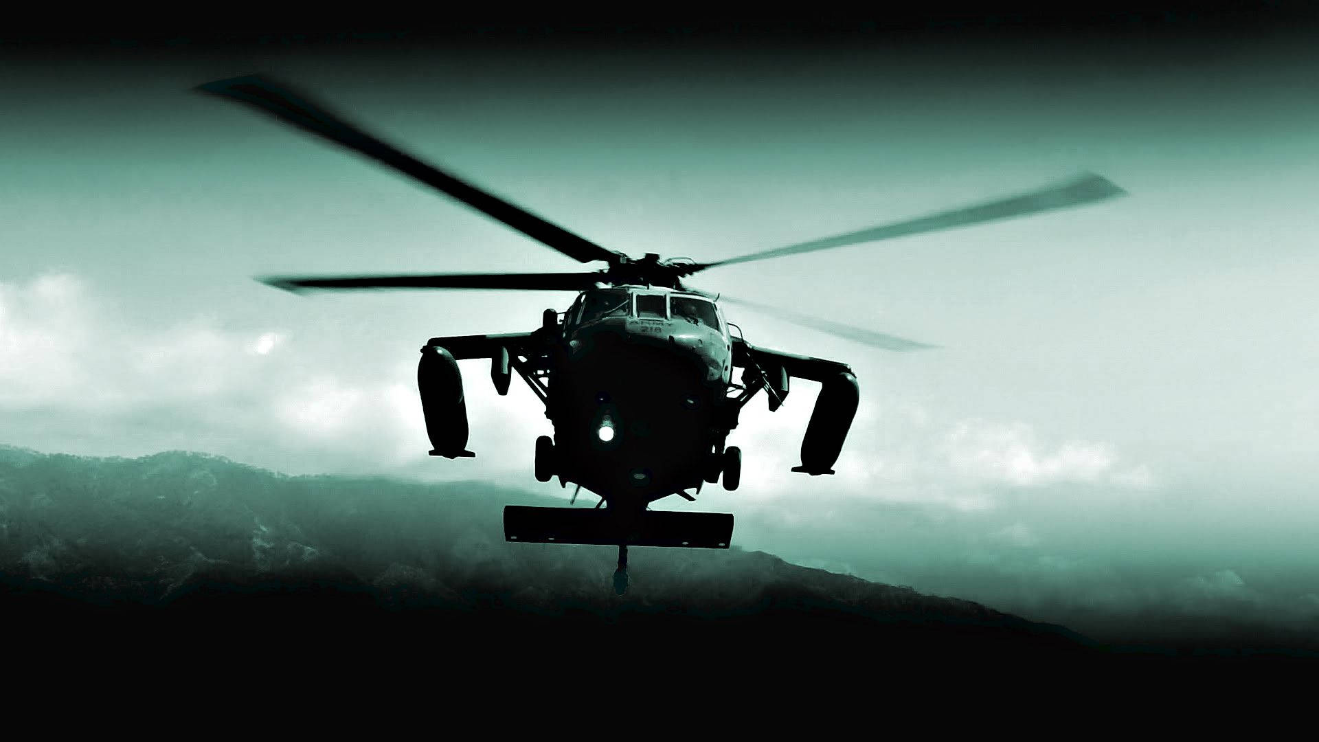 A View Of A U.s. Army Black Hawk Helicopter In Action Background