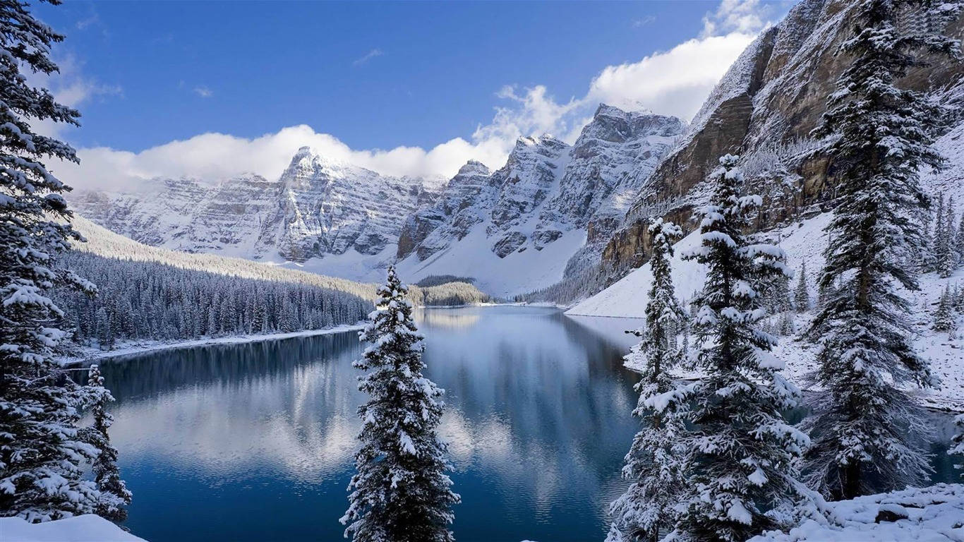 A View Of Beautiful Winter Scenery With Snow-covered Mountains And Trees Background